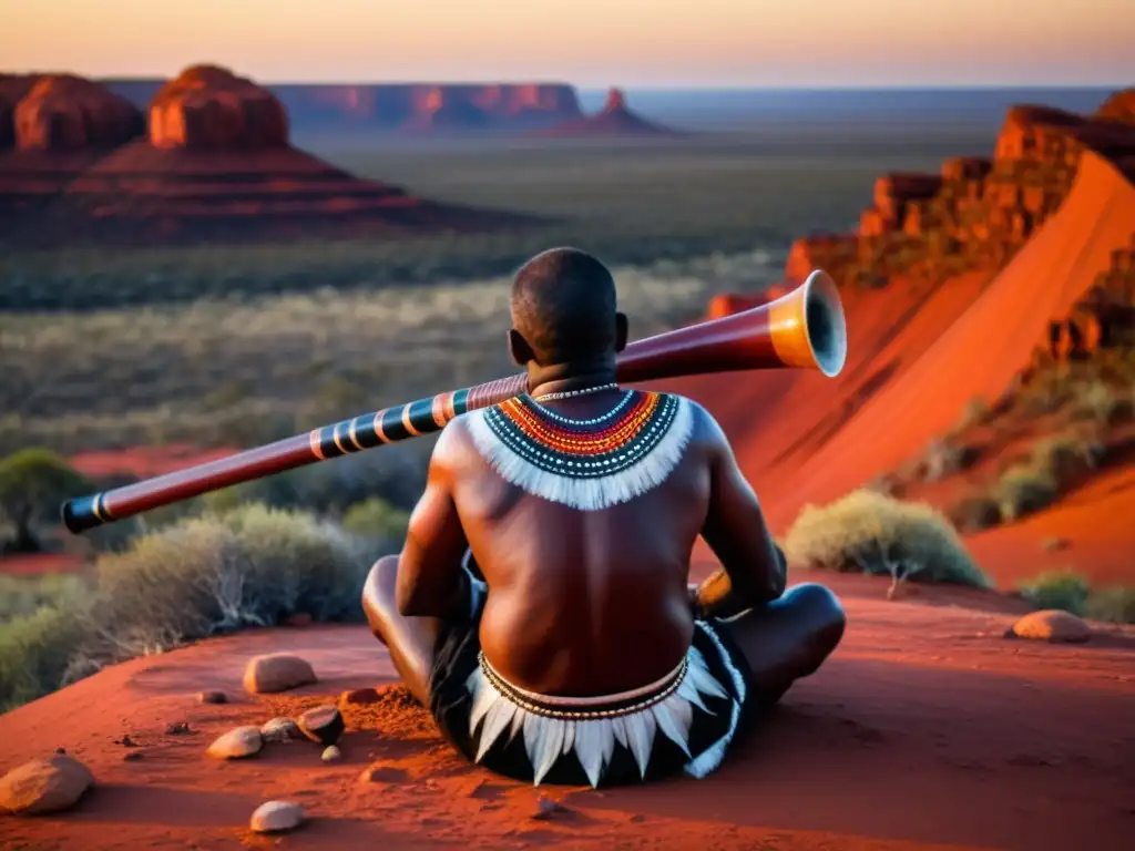 Un aborigen australiano toca el didgeridoo en un ritual sagrado en el outback, con paisaje deslumbrante al atardecer