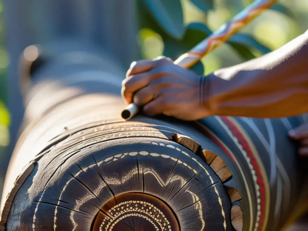 Un artista aborigen talla un didgeridoo en un tronco de eucalipto, resaltando el origen y significado del instrumento