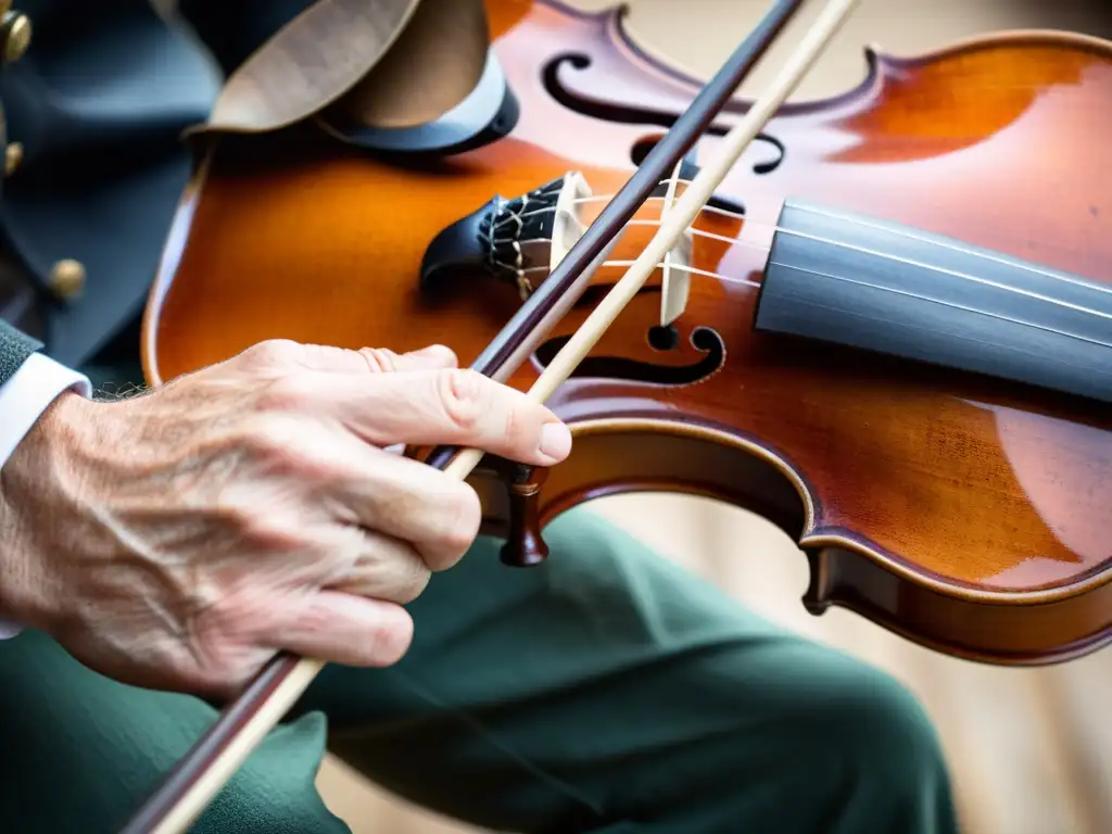 La hábil mano del violinista celta mueve grácilmente el arco sobre las cuerdas de madera de un violín envejecido