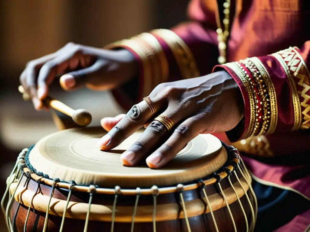 Manos en movimiento de un músico de tabla, mostrando las técnicas milenarias de percusión tabla india en una actuación en vivo