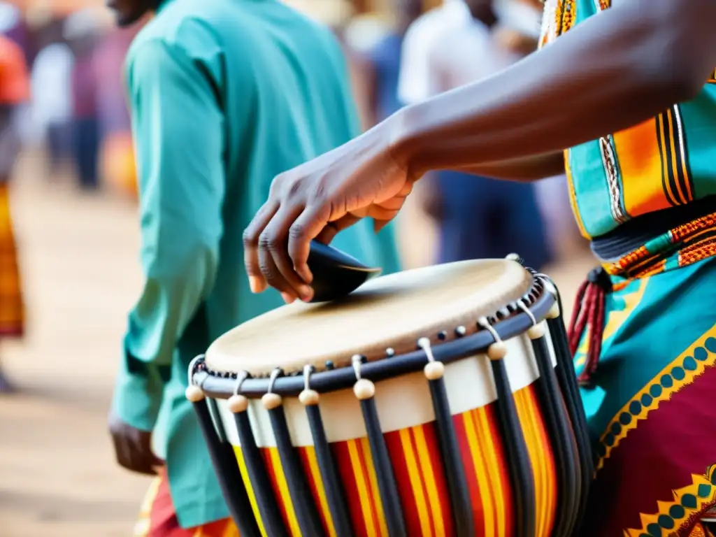 Un músico experto toca con destreza un tambor hablante de África Occidental durante una vibrante celebración cultural