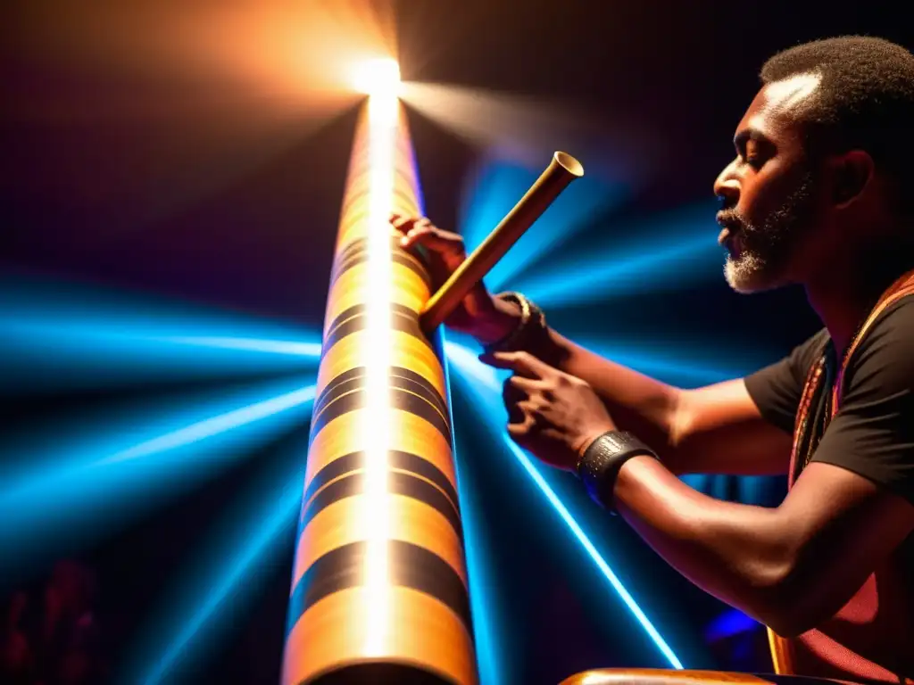 Un músico profesional toca un didgeridoo electrónico en un escenario, rodeado de una audiencia hipnotizada