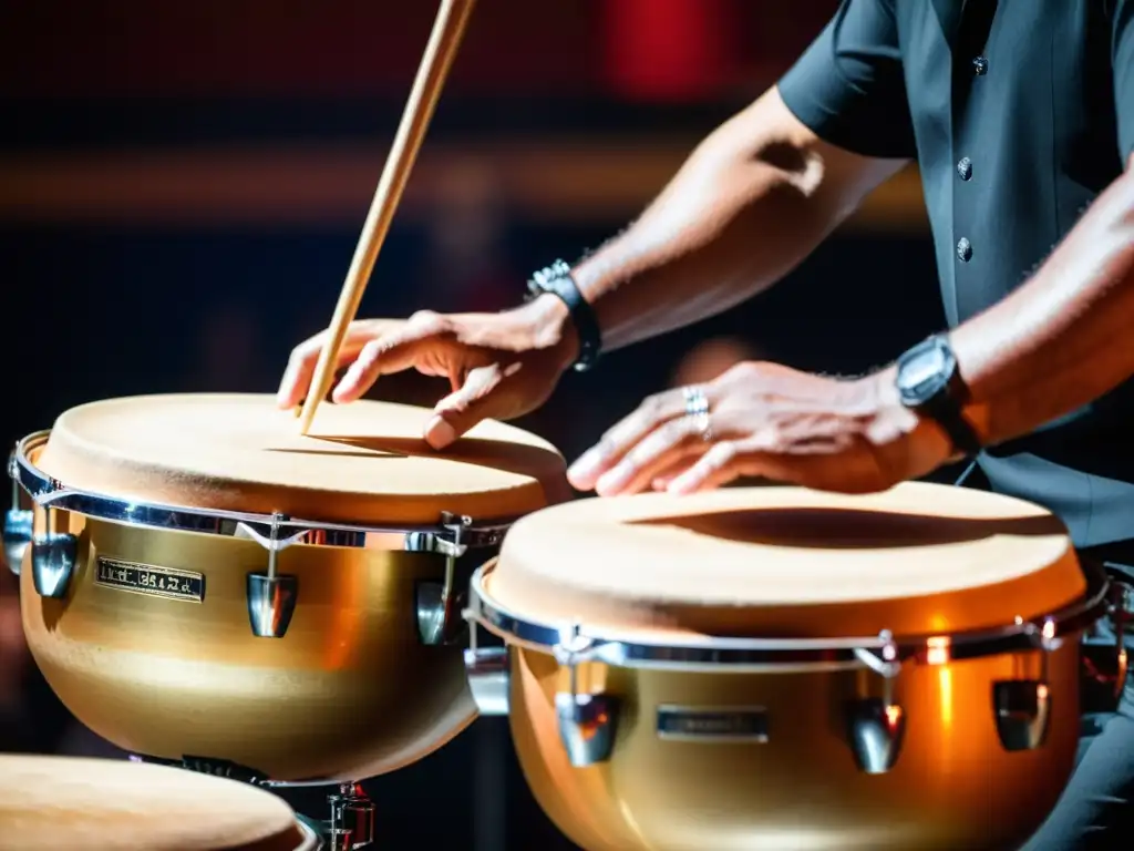 Un percusionista experto toca los timbales con pasión en un escenario de música latina, mostrando la importancia del timbal en música latina